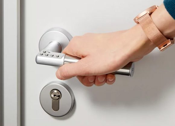 ASSA ABLOY Code Handle standalone digital PIN door handle installed on an office door.