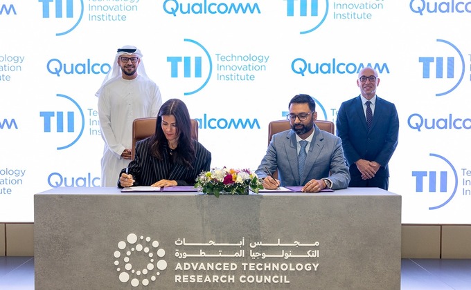 TII and Qualcomm representatives at a signing ceremony in Abu Dhabi