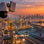 Radar and PTZ surveillance camera monitoring an industrial facility perimeter in Qatar