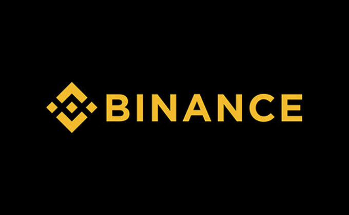 Binance cryptocurrency exchange logo in yellow on a black background