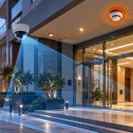 Residential building entrance in Dubai showing CCTV coverage and fire alarm systems