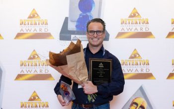 Eelko Griepink of OPTEX holding the Detektor International Award 2026 for the TXI Series outdoor intrusion detectors