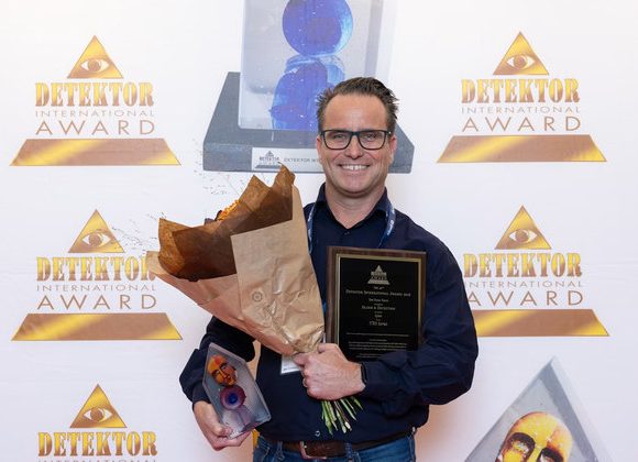 Eelko Griepink of OPTEX holding the Detektor International Award 2026 for the TXI Series outdoor intrusion detectors
